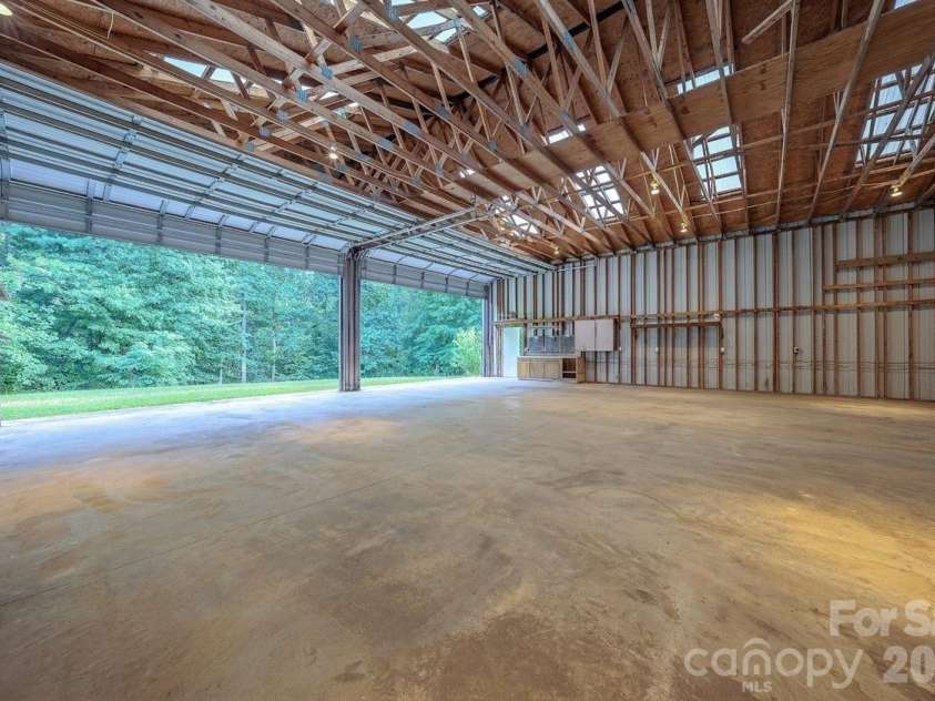 5 Kari Circle, Candler, NC 28715.  MLS# CAR4412820, YatesRealty ID 43469. Ample storage and two large doors in garage