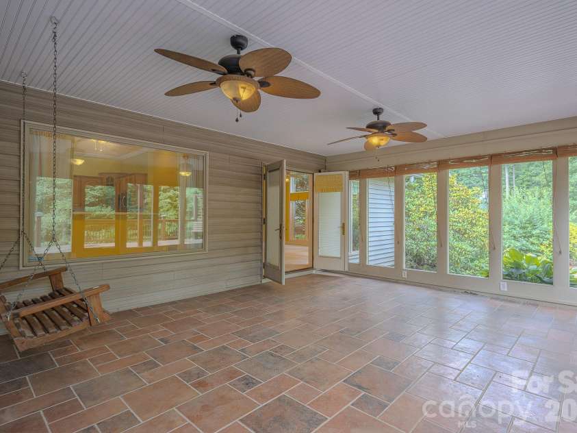 5 Kari Circle, Candler, NC 28715.  MLS# CAR4412820, YatesRealty ID 43469. Four seasons Room
