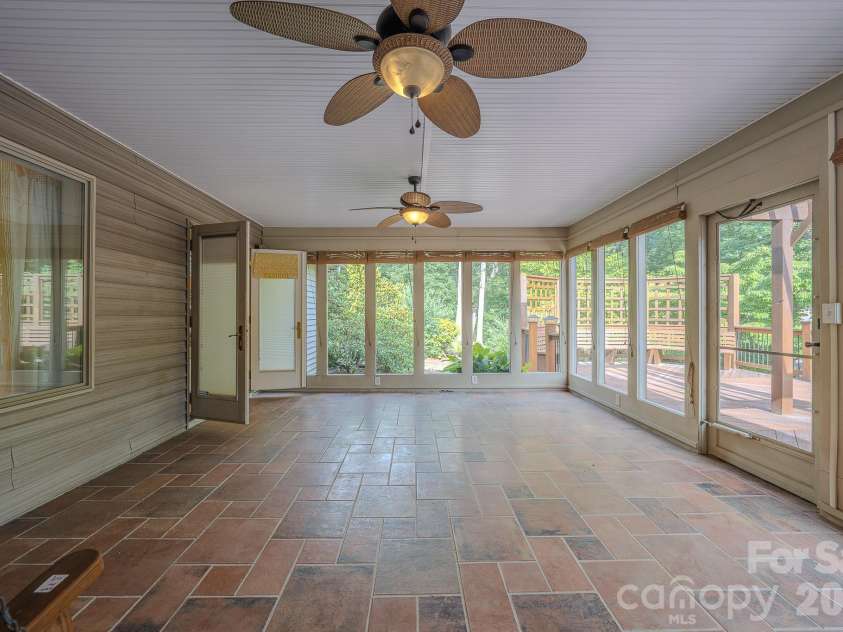 5 Kari Circle, Candler, NC 28715.  MLS# CAR4412820, YatesRealty ID 43469. Four seasons Room