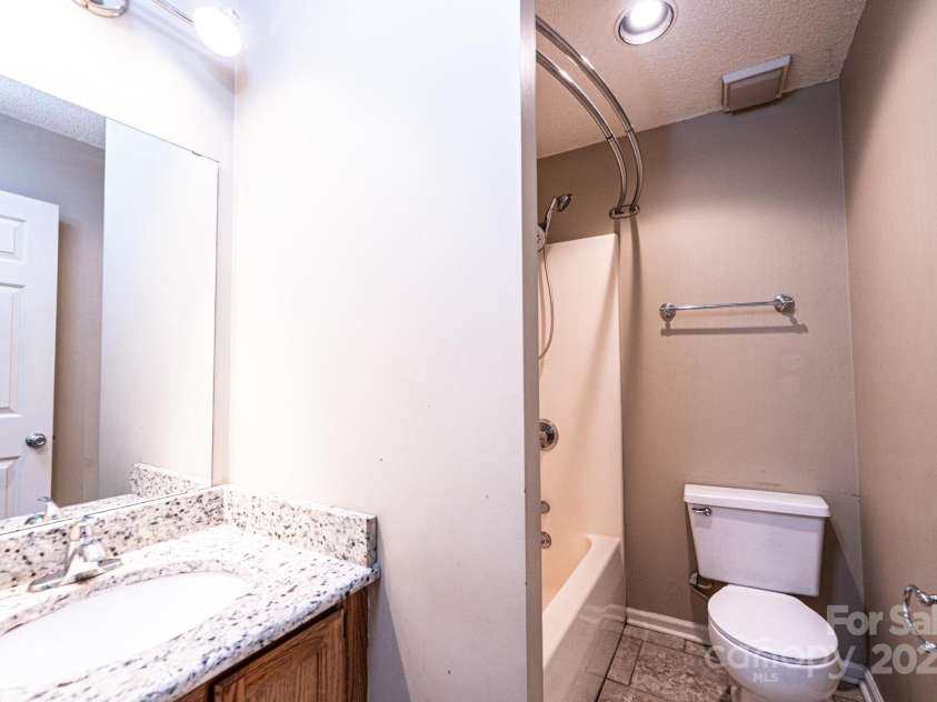 709 21st Avenue, Hickory, NC 28601.  MLS# CAR4276876, YatesRealty ID 4348. Hall Bathroom has granite counterops