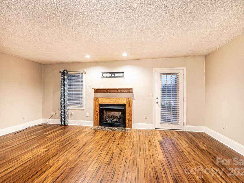 709 21st Avenue, Hickory, NC 28601.  MLS# CAR4276876, YatesRealty ID 4348. Living Room with access to patio