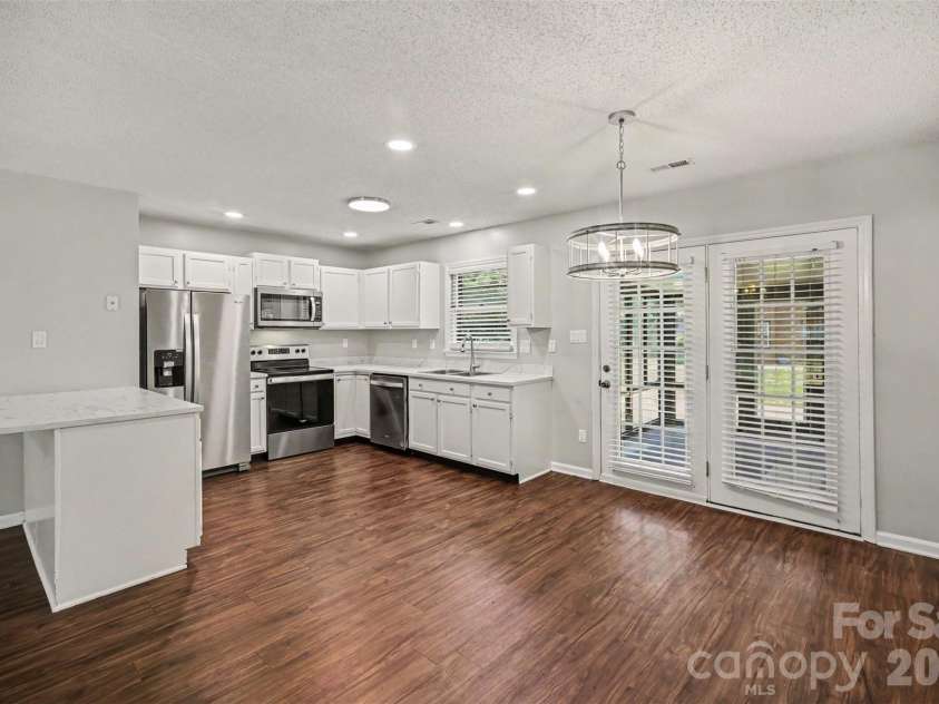 9720 Stillwater Lane, Mint Hill, NC 28227.  MLS# CAR4392489, YatesRealty ID 43501. Dining into kitchen