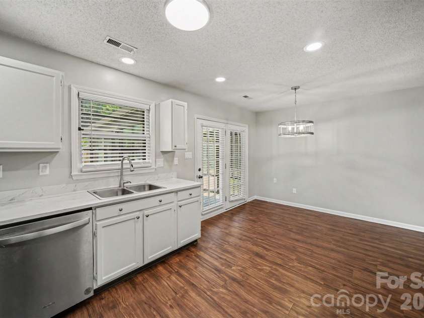 9720 Stillwater Lane, Mint Hill, NC 28227.  MLS# CAR4392489, YatesRealty ID 43501. Kitchen into dining