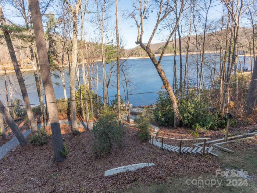 1679 Woods Mountain Trail, Cullowhee, NC 28723.  MLS# CAR4206125, YatesRealty ID 4351. 2 paths to beach, dock, and point