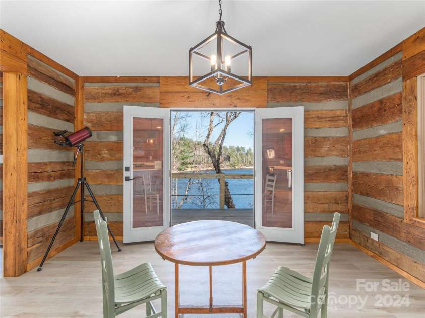 1679 Woods Mountain Trail, Cullowhee, NC 28723.  MLS# CAR4206125, YatesRealty ID 4351. Dining area overlooks lake