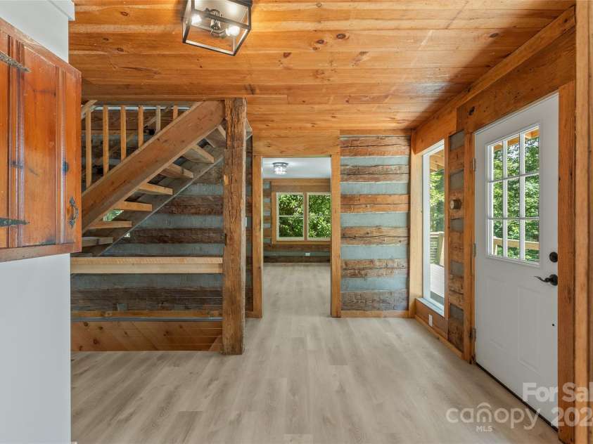 1679 Woods Mountain Trail, Cullowhee, NC 28723.  MLS# CAR4206125, YatesRealty ID 4351. Lakeside foyer area between dining/living rooms