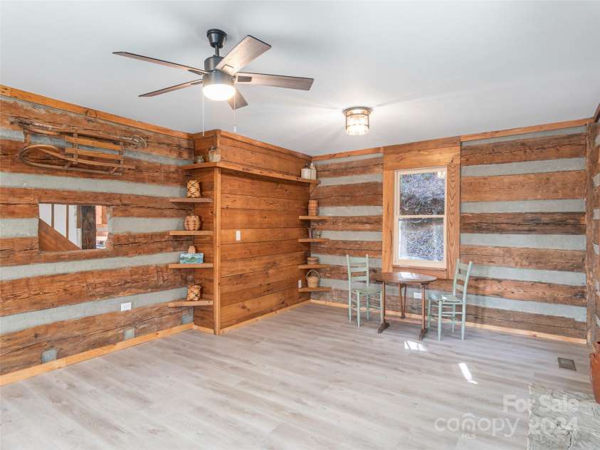 1679 Woods Mountain Trail, Cullowhee, NC 28723.  MLS# CAR4206125, YatesRealty ID 4351. Oversized living room 