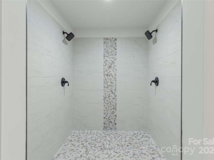 1679 Woods Mountain Trail, Cullowhee, NC 28723.  MLS# CAR4206125, YatesRealty ID 4351. Oversized tiled shower