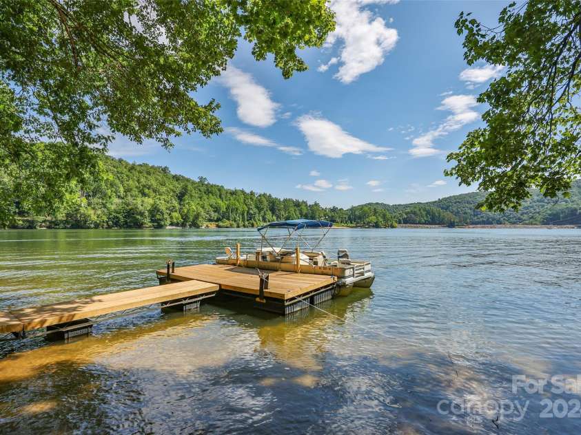 1679 Woods Mountain Trail, Cullowhee, NC 28723.  MLS# CAR4206125, YatesRealty ID 4351. Private dock and nearly 200’ lakefront