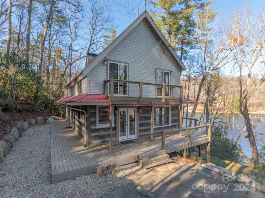 1679 Woods Mountain Trail, Cullowhee, NC 28723.  MLS# CAR4206125, YatesRealty ID 4351. Wraparound main level deck