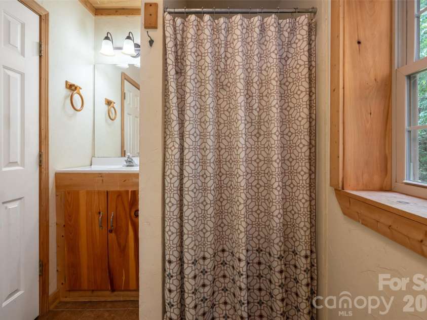 24 Gregory Hill Road, Fairview, NC 28730.  MLS# CAR4408771, YatesRealty ID 43545. Lower Level Bathroom