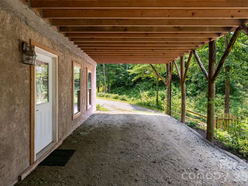 24 Gregory Hill Road, Fairview, NC 28730.  MLS# CAR4408771, YatesRealty ID 43545. Lower Level parking area