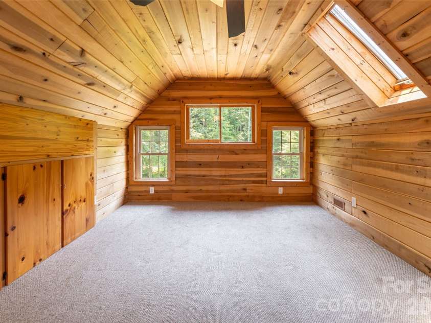 24 Gregory Hill Road, Fairview, NC 28730.  MLS# CAR4408771, YatesRealty ID 43545. Upstairs Bedroom with Build-In Storage