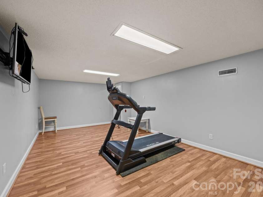 5 Silverstone Drive, Asheville, NC 28805.  MLS# CAR4303811, YatesRealty ID 4359. Basement Flex Space