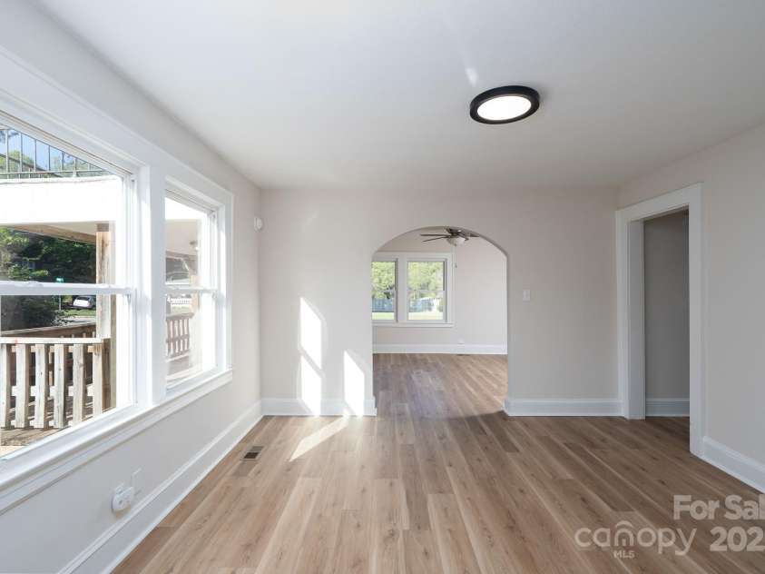 702 3rd Street, Spencer, NC 28159.  MLS# CAR4309115, YatesRealty ID 43594. Dining room view looking to the living room. New LVP flooring has been installed. 