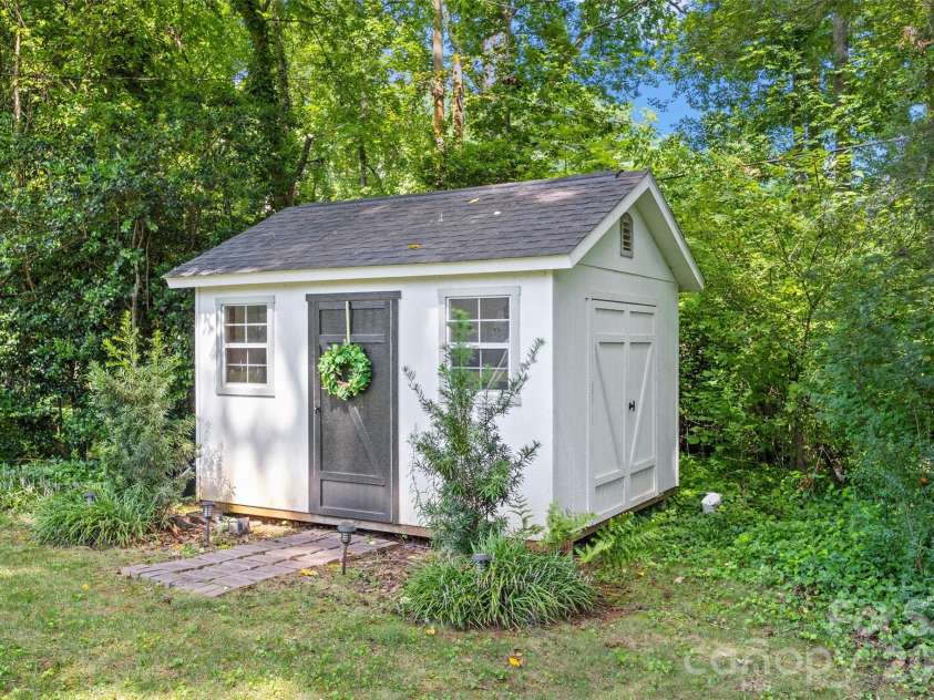 706 Unity Street, Fort Mill, SC 29715.  MLS# CAR4412427, YatesRealty ID 43597. Cute storage shed stays