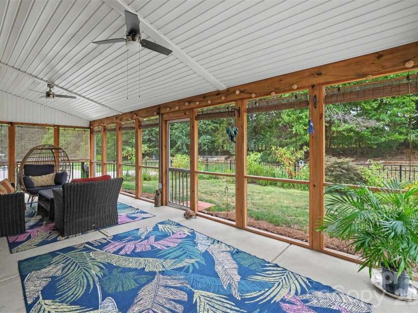 10120 Shanaclear Avenue, Concord, NC 28027.  MLS# CAR4406441, YatesRealty ID 43608. Screened in Back Porch