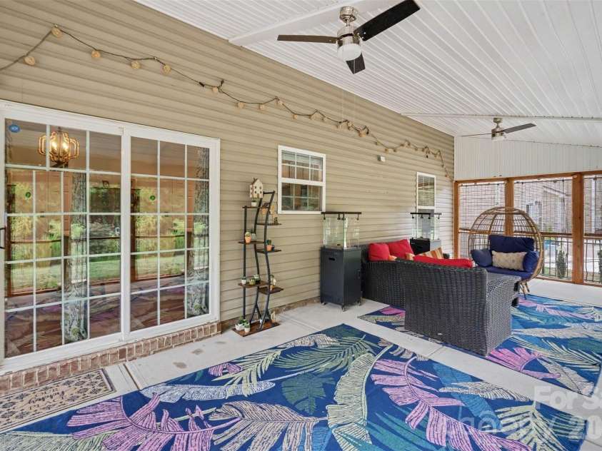 10120 Shanaclear Avenue, Concord, NC 28027.  MLS# CAR4406441, YatesRealty ID 43608. Screened in Back Porch