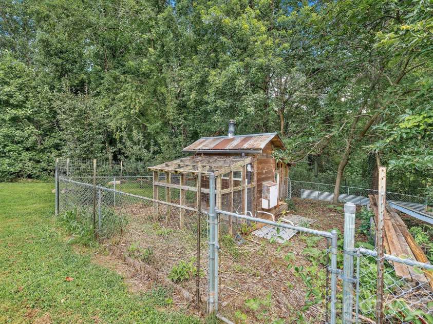 104 Justice Ridge Road, Candler, NC 28715.  MLS# CAR4396545, YatesRealty ID 43609. Chicken enclosure