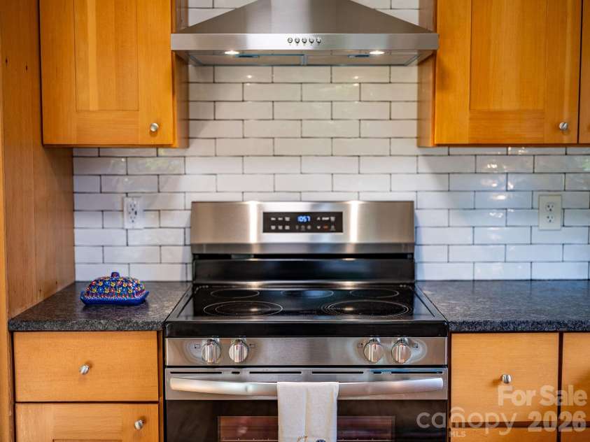 104 Justice Ridge Road, Candler, NC 28715.  MLS# CAR4396545, YatesRealty ID 43609. Exterior vented hood vent