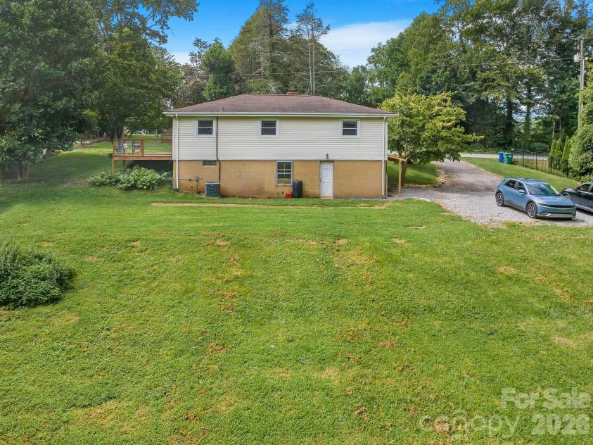 104 Justice Ridge Road, Candler, NC 28715.  MLS# CAR4396545, YatesRealty ID 43609. Huge versatile back yard