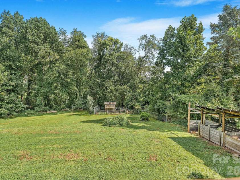 104 Justice Ridge Road, Candler, NC 28715.  MLS# CAR4396545, YatesRealty ID 43609. Large backyard