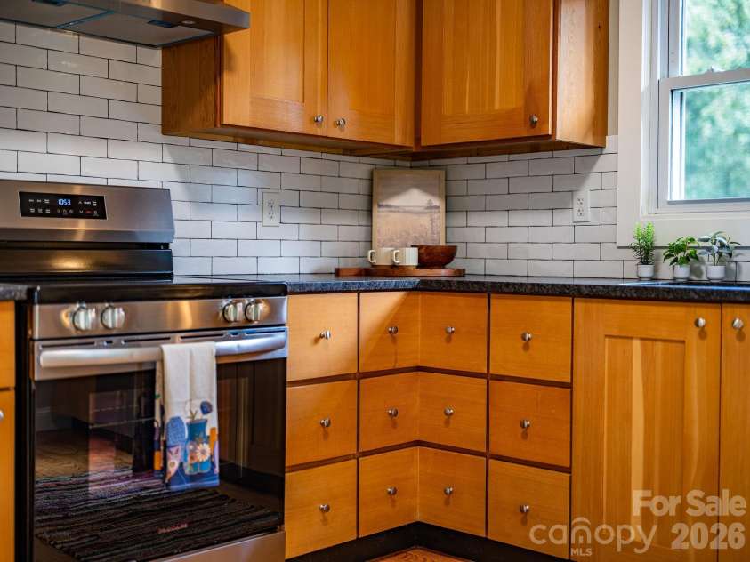 104 Justice Ridge Road, Candler, NC 28715.  MLS# CAR4396545, YatesRealty ID 43609. Leathered countertops