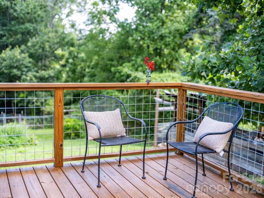 104 Justice Ridge Road, Candler, NC 28715.  MLS# CAR4396545, YatesRealty ID 43609. Relaxing deck