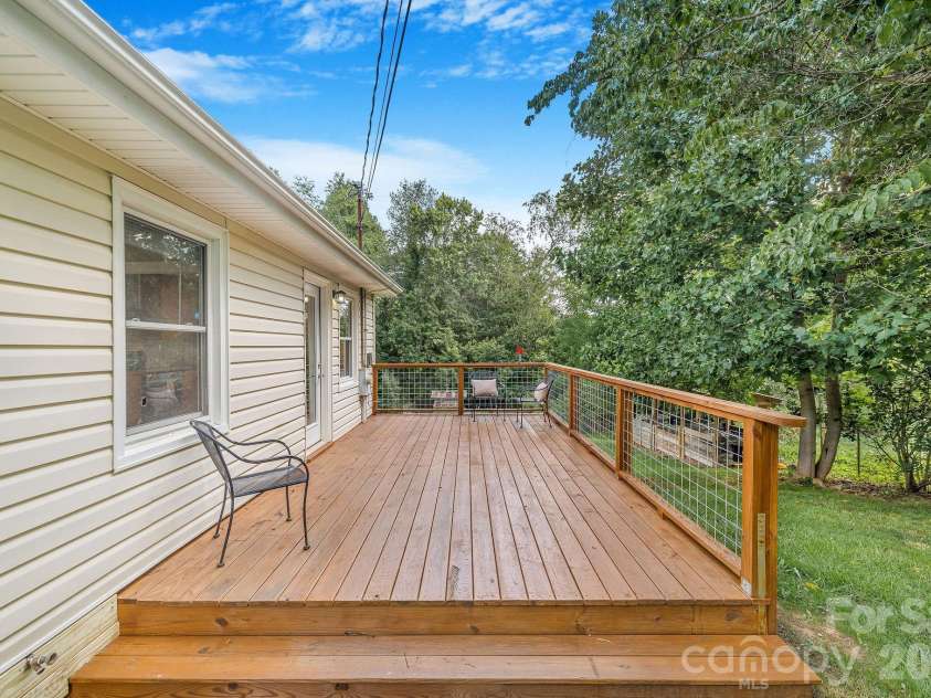 104 Justice Ridge Road, Candler, NC 28715.  MLS# CAR4396545, YatesRealty ID 43609. Updated deck off kitchen