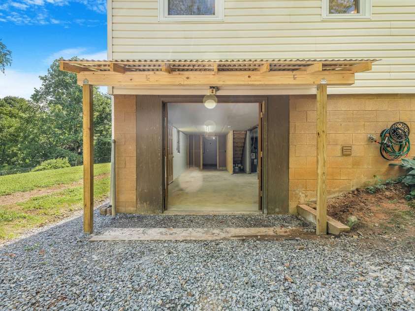 104 Justice Ridge Road, Candler, NC 28715.  MLS# CAR4396545, YatesRealty ID 43609. Walkout basement area