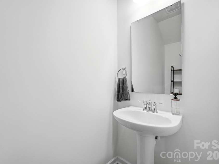 5243 Maynard Hill Drive, Monroe, NC 28110.  MLS# CAR4413326, YatesRealty ID 43634. Half bath near front entry.