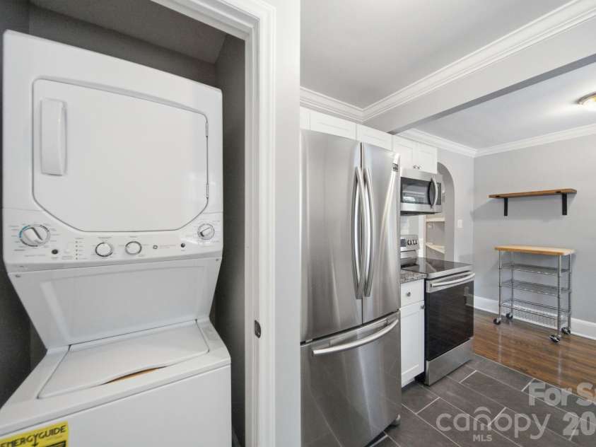 3137 Mathis Drive, Charlotte, NC 28208.  MLS# CAR4412024, YatesRealty ID 43639. Laundry closet in kitchen.