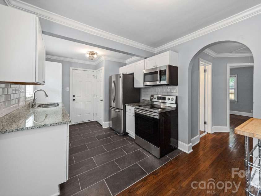 3137 Mathis Drive, Charlotte, NC 28208.  MLS# CAR4412024, YatesRealty ID 43639. More arches!  And a great kitchen to prep meals in.