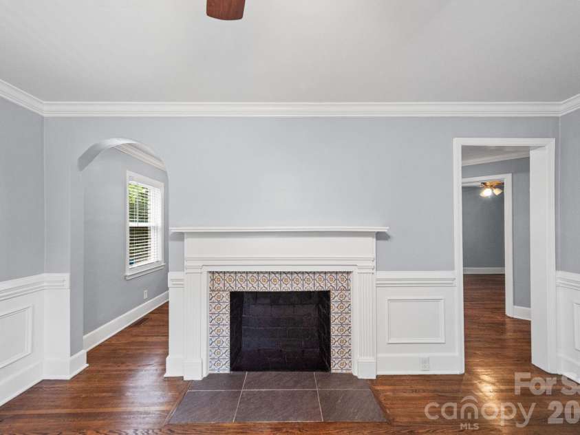 3137 Mathis Drive, Charlotte, NC 28208.  MLS# CAR4412024, YatesRealty ID 43639. Quaint living room with a beautiful fireplace.