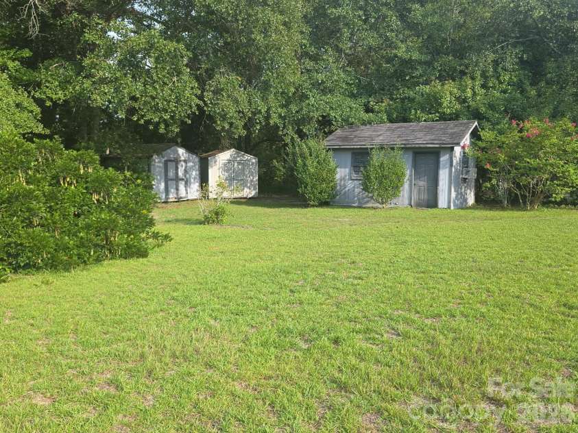 401 Hickory Street, Pageland, SC 29728.  MLS# CAR4408598, YatesRealty ID 43644. Backyard storage