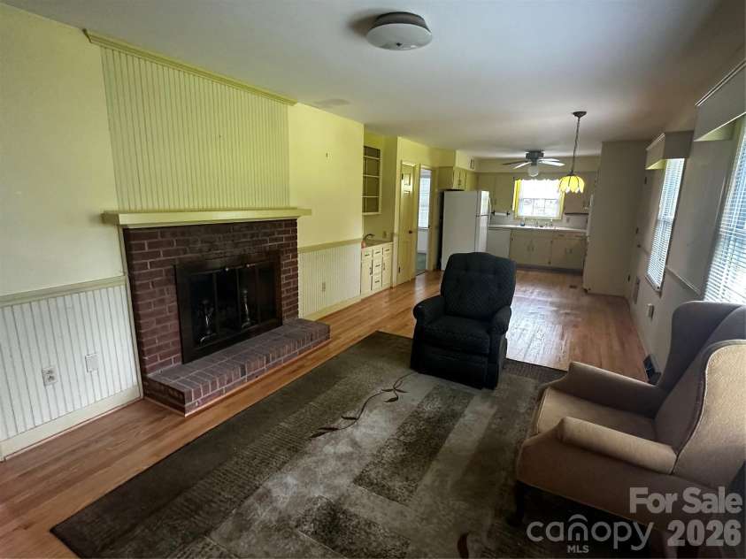 401 Hickory Street, Pageland, SC 29728.  MLS# CAR4408598, YatesRealty ID 43644. Den with fireplace looking towards kitchen