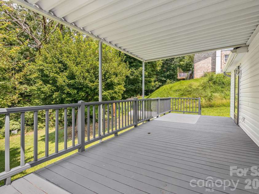 303 Hunter Street, Burnsville, NC 28714.  MLS# CAR4413835, YatesRealty ID 43668. 