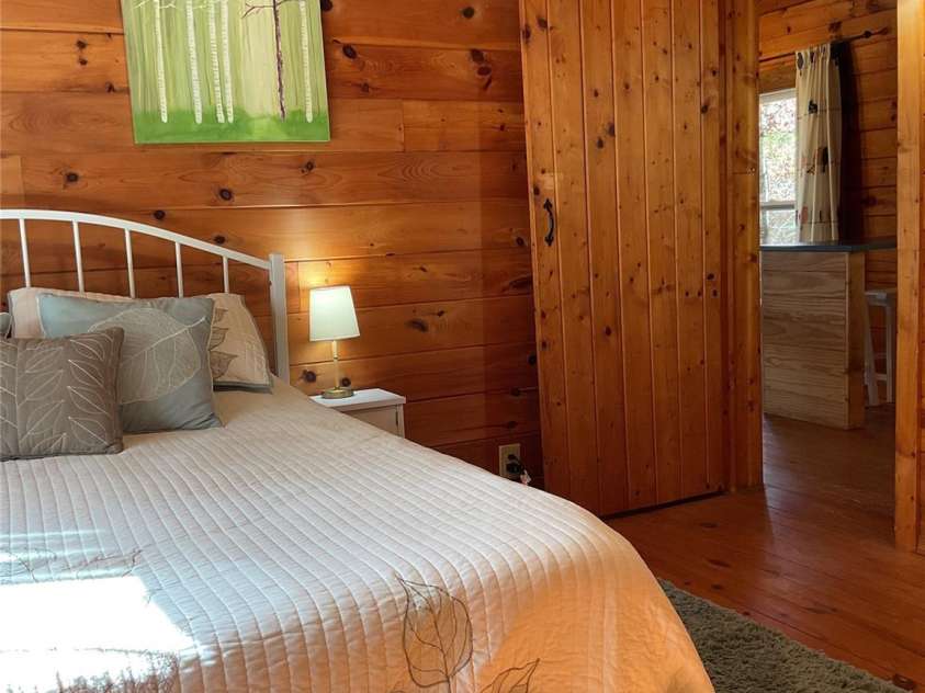 1446 Mcguinn Road, Mill Spring, NC 28756.  MLS# CAR4195239, YatesRealty ID 4367. From inside bedroom, looking out towards kitchen.