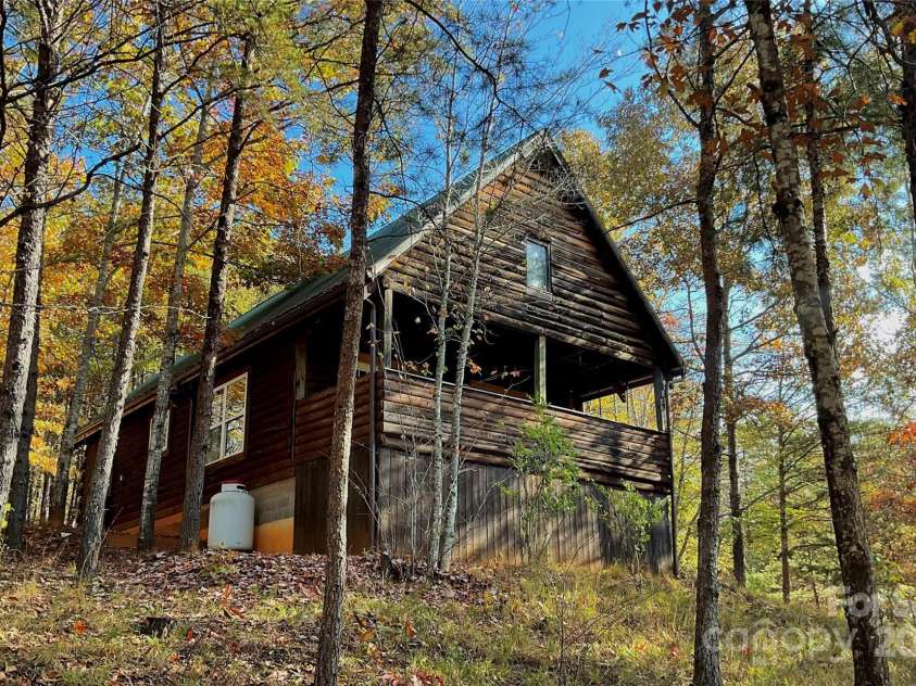 1446 Mcguinn Road, Mill Spring, NC 28756.  MLS# CAR4195239, YatesRealty ID 4367. Front of house, from entrance to driveway