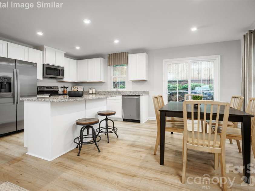 6152 Bridle Creek Drive, Charlotte, NC 28214.  MLS# CAR4413954, YatesRealty ID 43670. Host with confidence! This spacious kitchen island flows seamlessly into the dining area—ideal for gatherings, family meals, and everyday living.