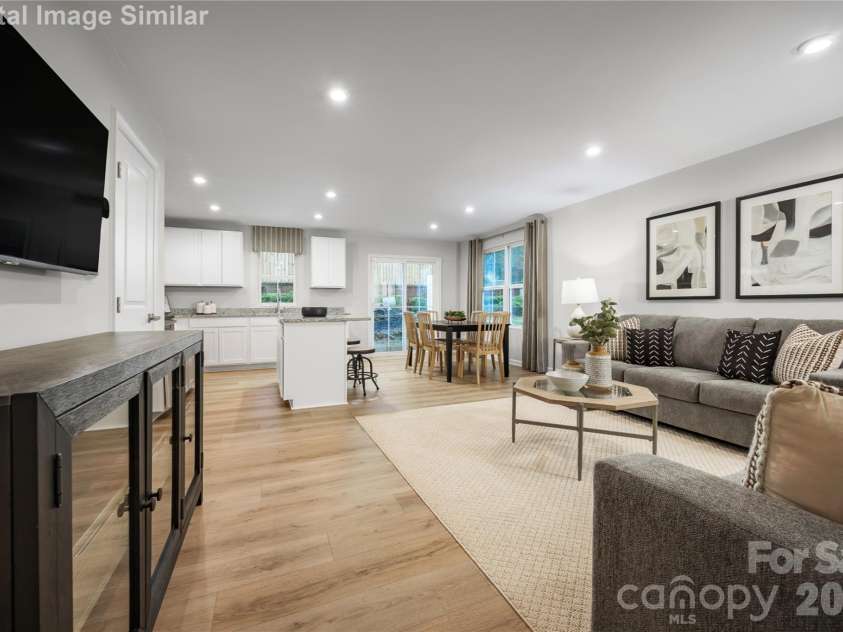 6152 Bridle Creek Drive, Charlotte, NC 28214.  MLS# CAR4413954, YatesRealty ID 43670. Open, inviting, and effortlessly connected—this Great Room blends kitchen, dining, and living spaces for seamless everyday comfort and entertaining.