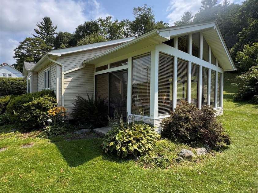 189 Old NC 181 Highway, Newland, NC 28657.  MLS# CAR4413944, YatesRealty ID 43698. Outside Sunroom