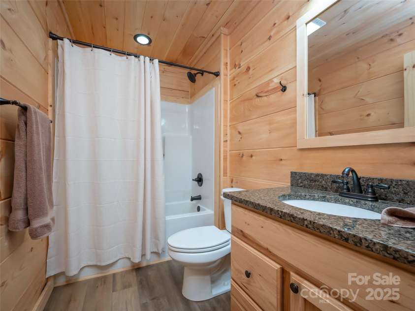 344 Wolf Trail, Lake Lure, NC 28746.  MLS# CAR4126442, YatesRealty ID 4372. Full Guest bathroom with granite countertops