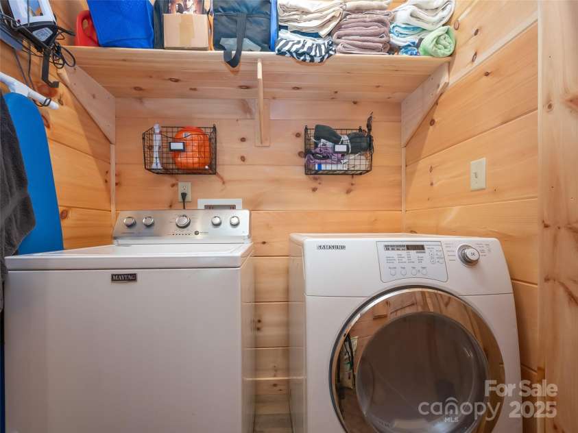 344 Wolf Trail, Lake Lure, NC 28746.  MLS# CAR4126442, YatesRealty ID 4372. Laundry space with shelving and conveniently located on the main level!