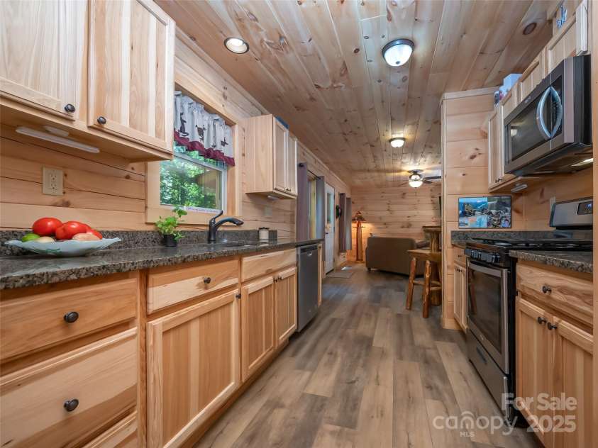 344 Wolf Trail, Lake Lure, NC 28746.  MLS# CAR4126442, YatesRealty ID 4372. Luxury vinyl flooring that is waterproof and scratch resistant throughout the main level