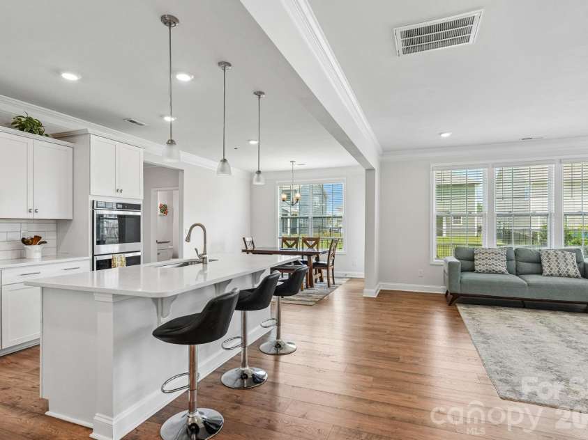 1093 Thoroughbred Drive, Iron Station, NC 28080.  MLS# CAR4413596, YatesRealty ID 43730. Kitchen and Living Room