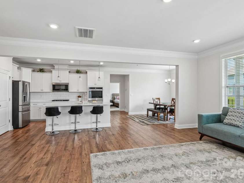 1093 Thoroughbred Drive, Iron Station, NC 28080.  MLS# CAR4413596, YatesRealty ID 43730. Kitchen and Living Room