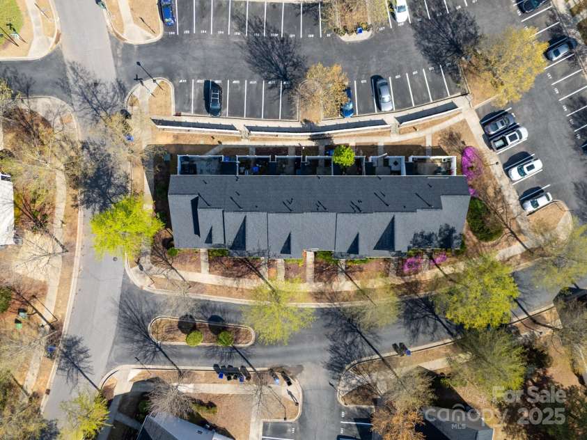 107 Forester Street, Mooresville, NC 28117.  MLS# CAR4241851, YatesRealty ID 4375. Parking for the unit is just steps away from the backdoor entrance.