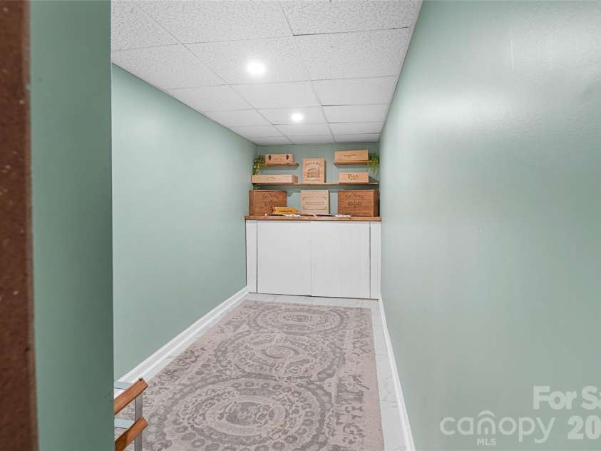 4341 Old Saybrook Court, Charlotte, NC 28211.  MLS# CAR4375795, YatesRealty ID 43751. A hidden wine vault adds an unexpected touch!