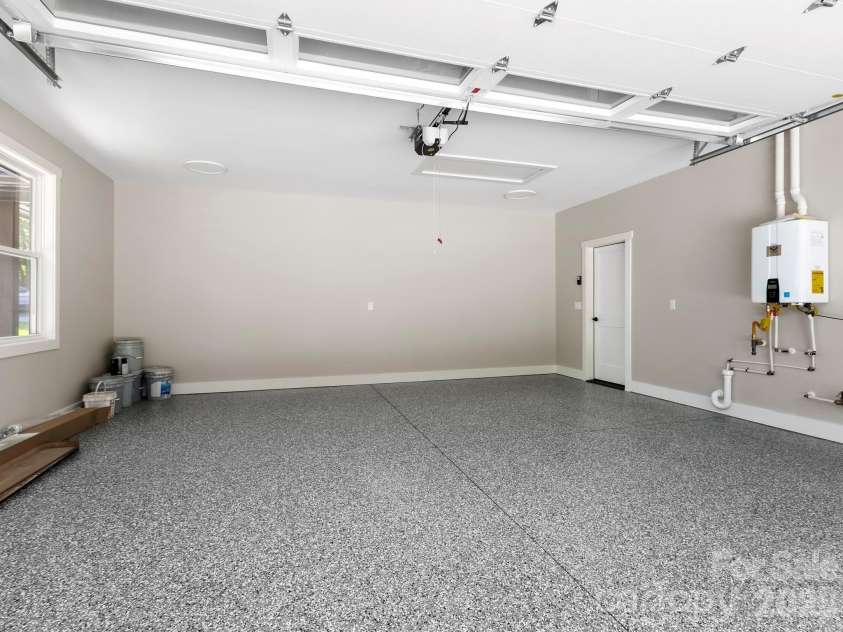 229 Asbury Road, Candler, NC 28715.  MLS# CAR4413275, YatesRealty ID 43761. Garage